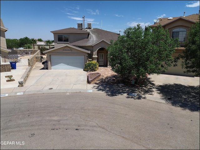 3517 Tierra Bahia Dr, El Paso, TX 79938 - traditional-style house with driveway, stucco siding, and an attached garage