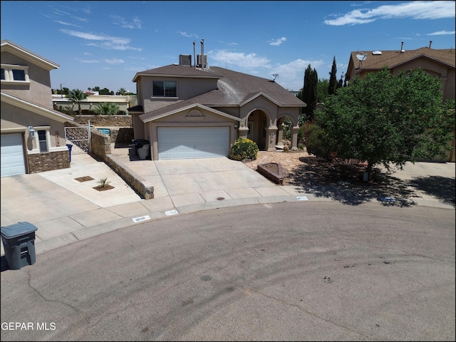 3517 Tierra Bahia Dr, El Paso, TX 79938 - view of front facade with concrete driveway and stucco siding