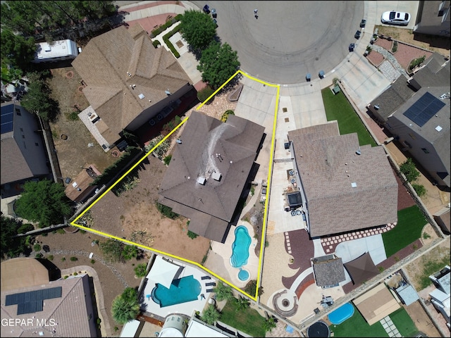 3517 Tierra Bahia Dr, El Paso, TX 79938 - aerial perspective of suburban area with a pool area and property boundaries highlighted