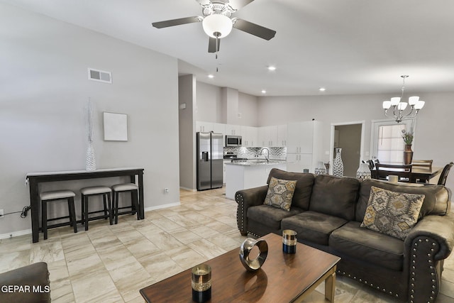 14744 Charles Foster Ave, El Paso, TX 79938 - living room with a chandelier, ceiling fan, and recessed lighting