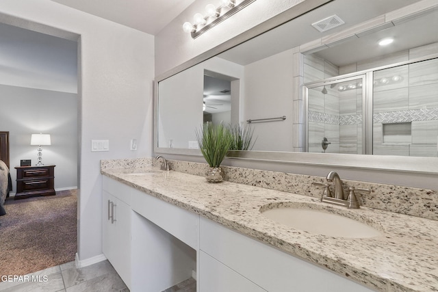 14744 Charles Foster Ave, El Paso, TX 79938 - ensuite bathroom featuring double vanity, a stall shower, and ceiling fan