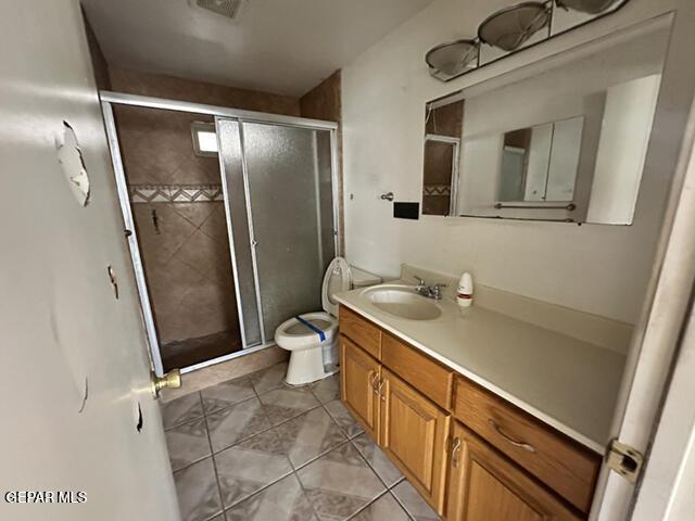 209 Durrill Rd, El Paso, TX 79915 - full bathroom with vanity, a stall shower, and tile patterned flooring