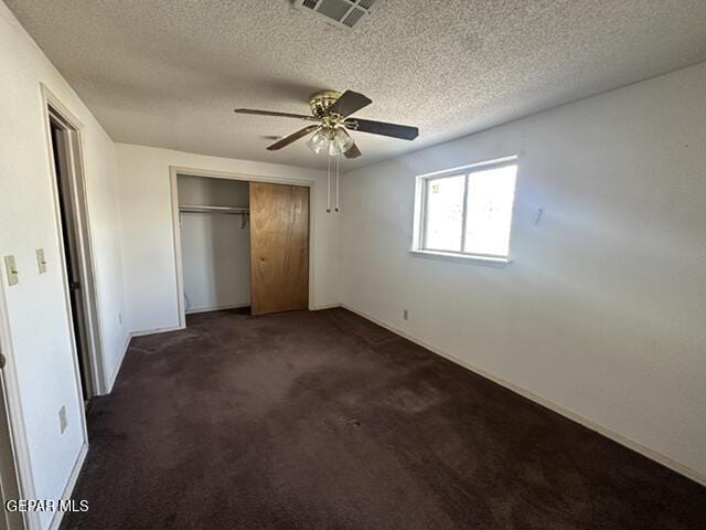 209 Durrill Rd, El Paso, TX 79915 - unfurnished bedroom with carpet floors, a textured ceiling, a closet, and a ceiling fan
