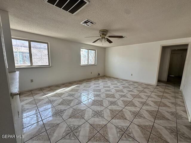 209 Durrill Rd, El Paso, TX 79915 - empty room featuring a textured ceiling and ceiling fan