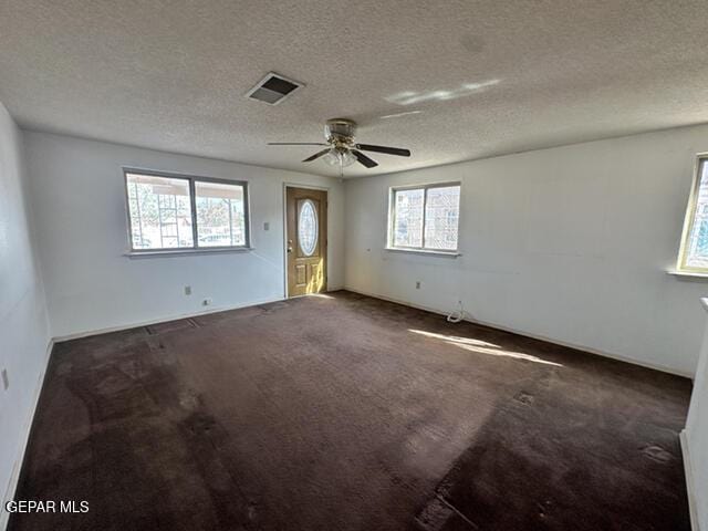 209 Durrill Rd, El Paso, TX 79915 - carpeted empty room with a textured ceiling and ceiling fan
