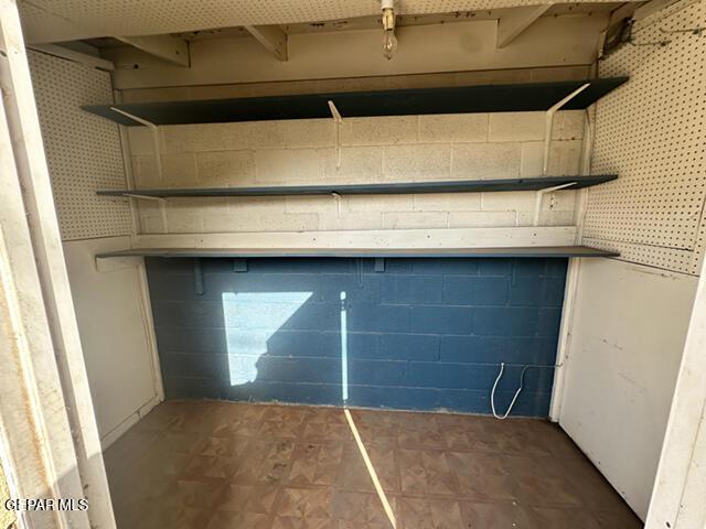 209 Durrill Rd, El Paso, TX 79915 - garage featuring concrete block wall