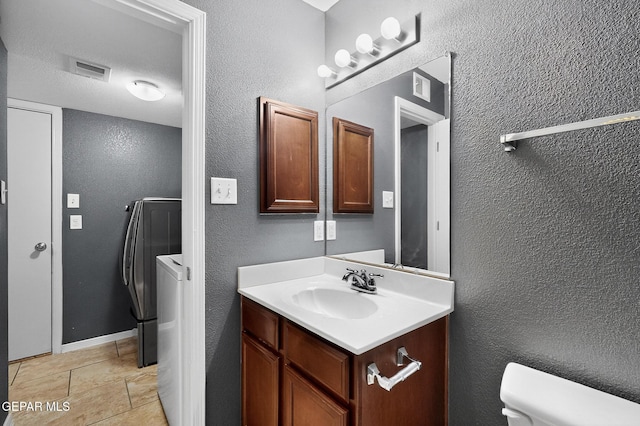 4640 Beacham St, El Paso, TX 79938 - bathroom with vanity and a textured wall