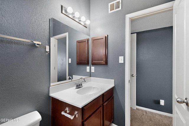 4640 Beacham St, El Paso, TX 79938 - half bathroom featuring vanity and a textured wall