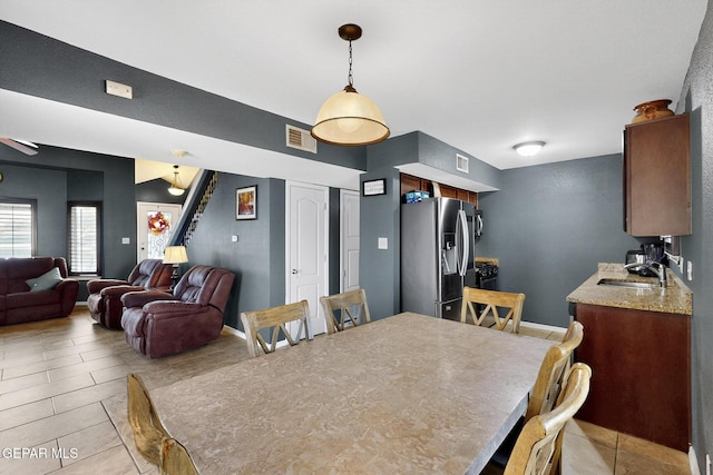 4640 Beacham St, El Paso, TX 79938 - dining room with light tile patterned floors and a ceiling fan