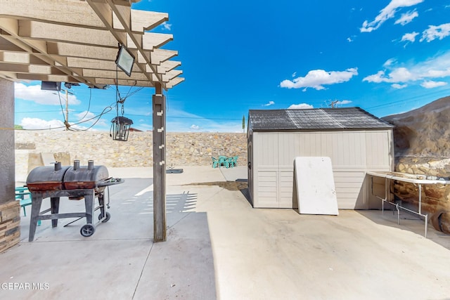 4640 Beacham St, El Paso, TX 79938 - view of patio featuring a storage shed, a pergola, and area for grilling