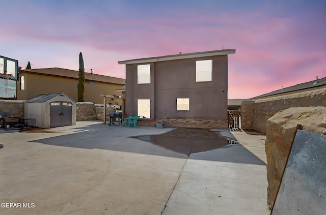 4640 Beacham St, El Paso, TX 79938 - back of property featuring a shed, a patio area, and stucco siding