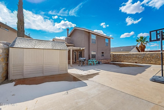 4640 Beacham St, El Paso, TX 79938 - rear view of property with a storage shed and a patio area