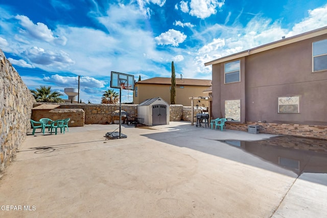 4640 Beacham St, El Paso, TX 79938 - fenced backyard featuring a storage shed and a patio