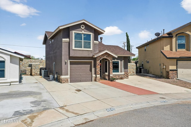 4640 Beacham St, El Paso, TX 79938 - traditional home featuring stone siding, stucco siding, an attached garage, driveway, and roof with shingles