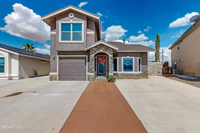 4640 Beacham St, El Paso, TX 79938 - view of front of property featuring stone siding, stucco siding, driveway, and a garage