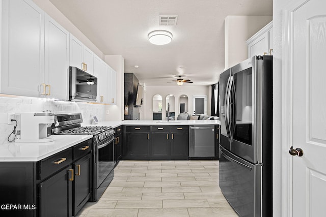 12334 Westbury, El Paso, TX 79928 - kitchen with appliances with stainless steel finishes, white cabinets, ceiling fan, and light countertops