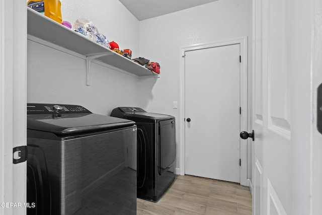 12334 Westbury, El Paso, TX 79928 - washroom with separate washer and dryer and light wood-style floors