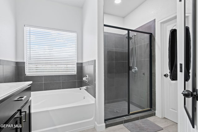 12334 Westbury, El Paso, TX 79928 - bathroom with a stall shower, a garden tub, vanity, and healthy amount of natural light