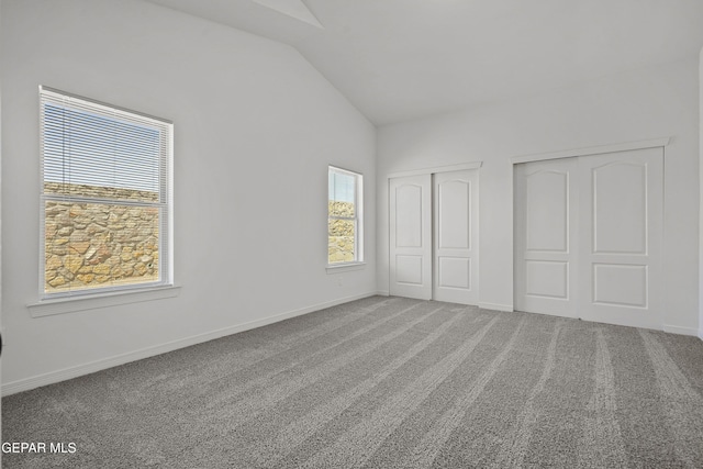 224 Penbridge Pl, El Paso, TX 79928 - unfurnished bedroom with lofted ceiling, multiple closets, and carpet floors