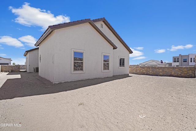 224 Penbridge Pl, El Paso, TX 79928 - rear view of house with a fenced backyard and stucco siding