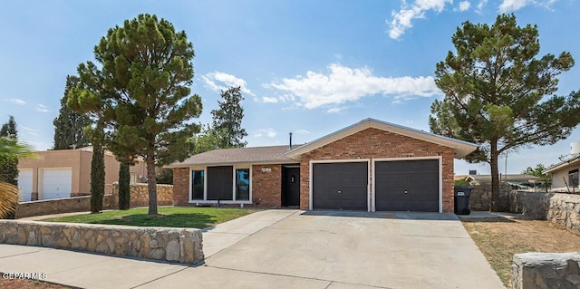 1615 Opossum Cir, Horizon City, TX 79928 - ranch-style house with brick siding, a garage, and concrete driveway