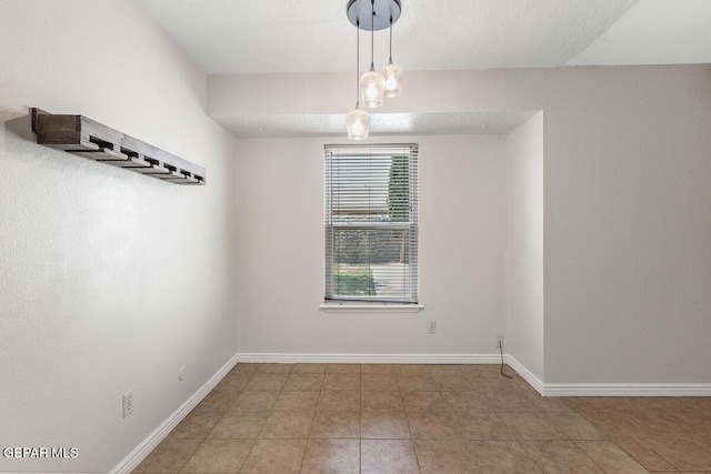 1615 Opossum Cir, Horizon City, TX 79928 - spare room with baseboards and tile patterned flooring