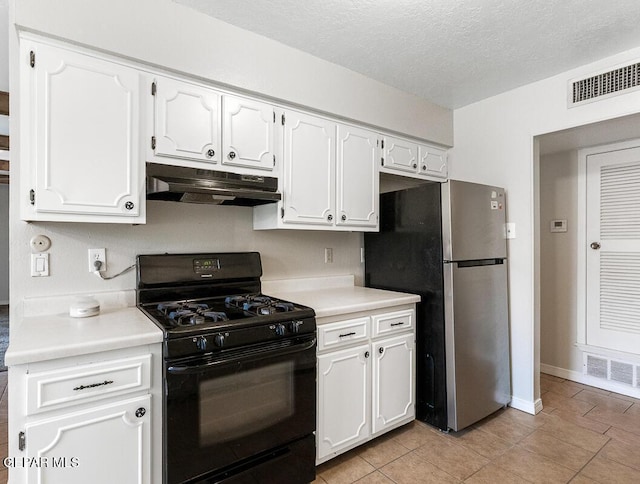 1615 Opossum Cir, Horizon City, TX 79928 - kitchen with black gas range oven, under cabinet range hood, light countertops, white cabinets, and a textured ceiling
