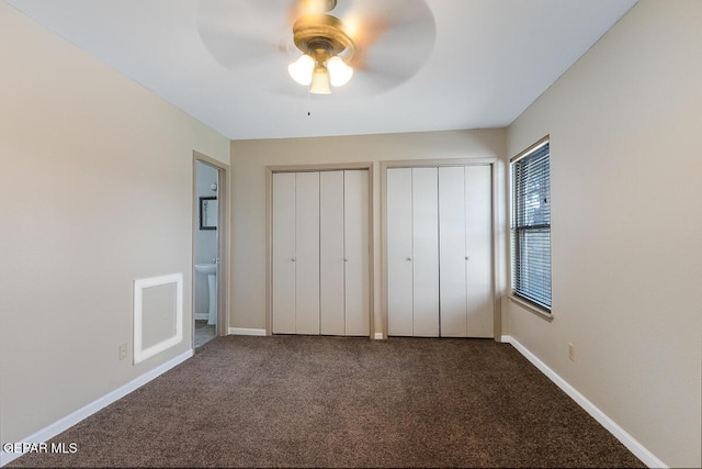 1615 Opossum Cir, Horizon City, TX 79928 - unfurnished bedroom with multiple closets, carpet flooring, and a ceiling fan