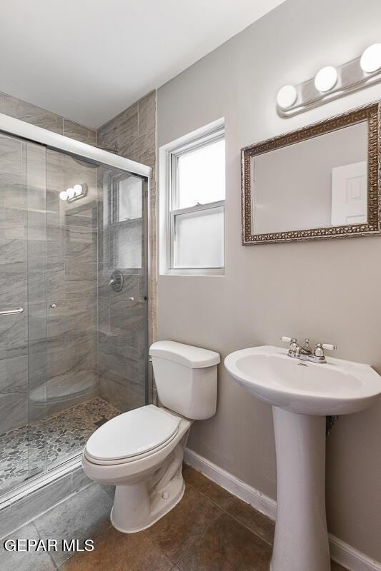 1615 Opossum Cir, Horizon City, TX 79928 - bathroom with a stall shower and tile patterned flooring