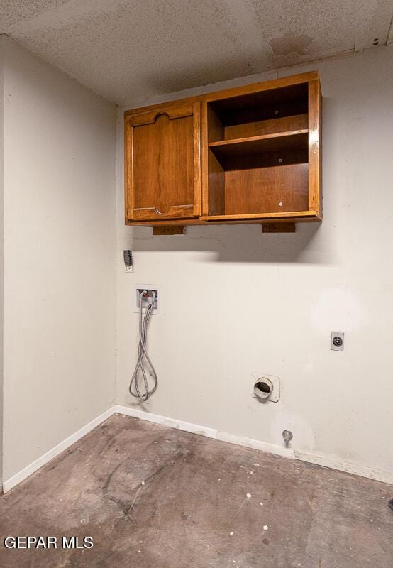 1615 Opossum Cir, Horizon City, TX 79928 - laundry room featuring cabinet space, hookup for an electric dryer, and washer hookup