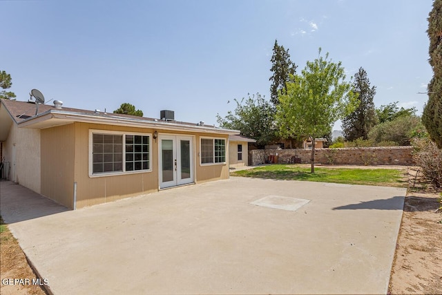 1615 Opossum Cir, Horizon City, TX 79928 - rear view of house with french doors and a patio area
