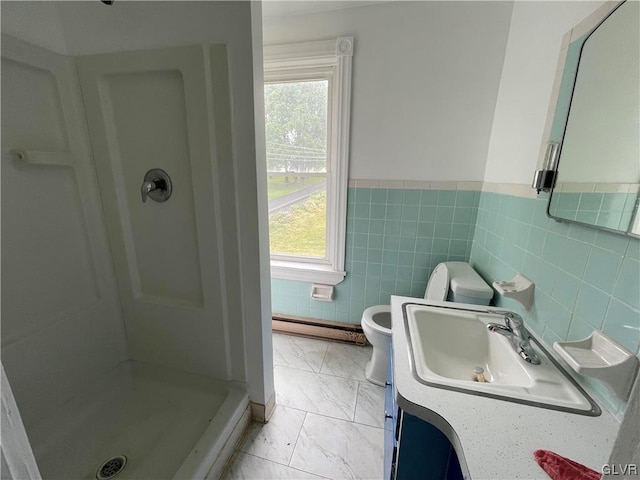 bathroom featuring vanity, baseboard heating, walk in shower, tile walls, and toilet