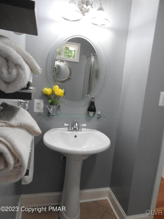 bathroom with tile patterned floors