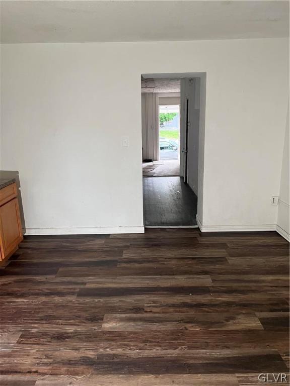 empty room featuring dark hardwood / wood-style floors