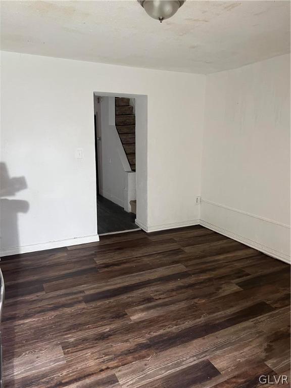 spare room with hardwood / wood-style floors