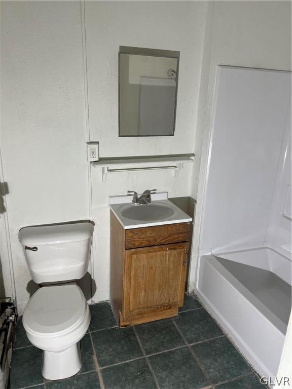 full bathroom with tile patterned flooring, toilet, shower / tub combination, and vanity