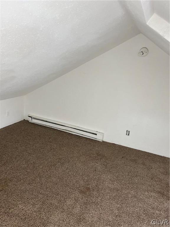 bonus room with carpet, lofted ceiling, and a baseboard heating unit