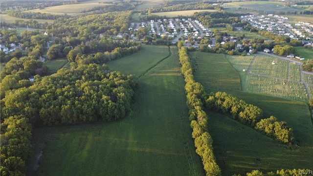 birds eye view of property featuring a water view and a rural view