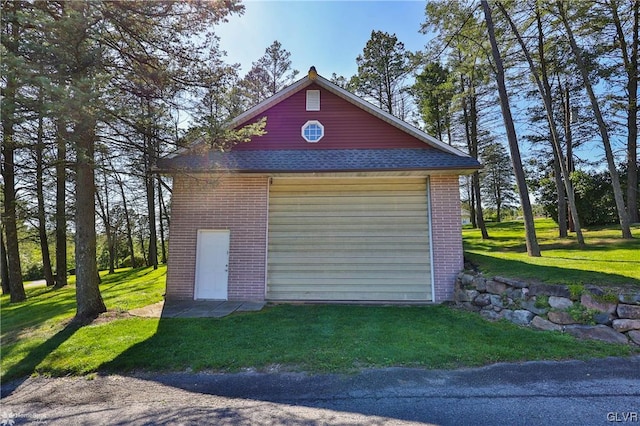 garage with a yard