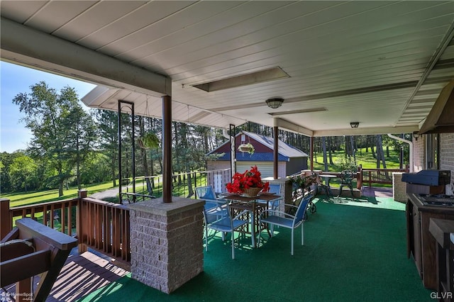 exterior space with a yard and an outbuilding