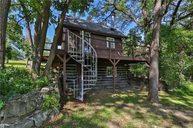 back of house featuring a deck