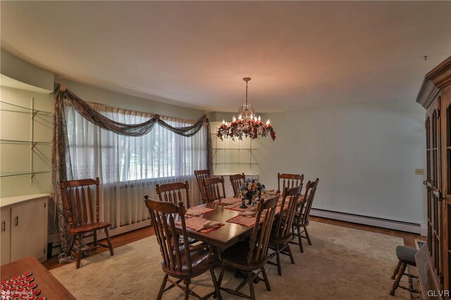 dining room featuring a baseboard radiator and an inviting chandelier