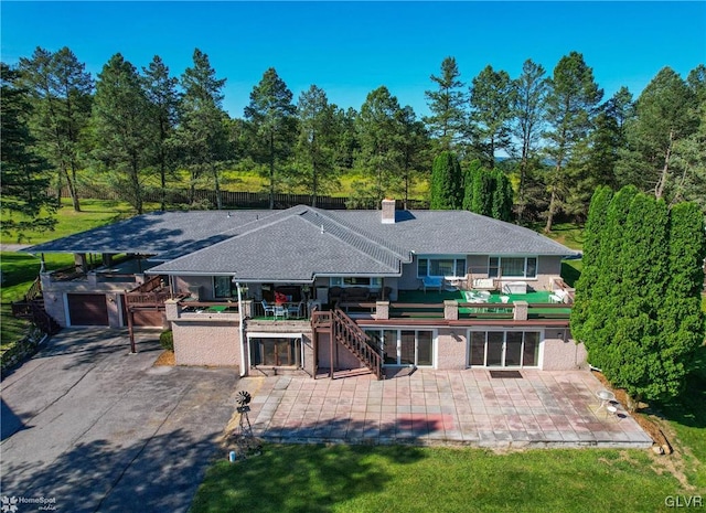 back of property with a patio area