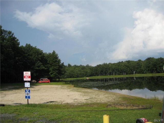 surrounding community featuring a water view