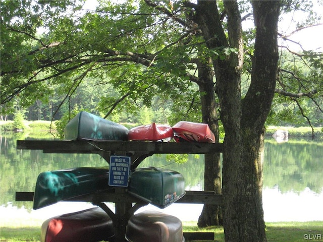 view of parking / parking lot with a water view