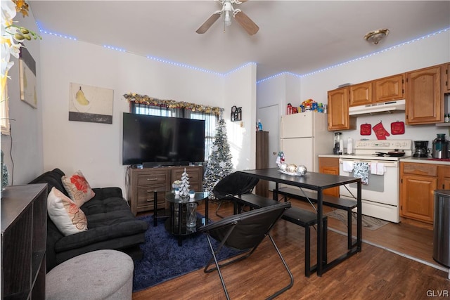 living room with ceiling fan and dark wood-type flooring