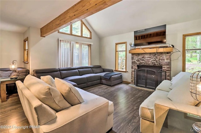 living room with a fireplace, lofted ceiling with beams, dark wood-type flooring, and a wealth of natural light