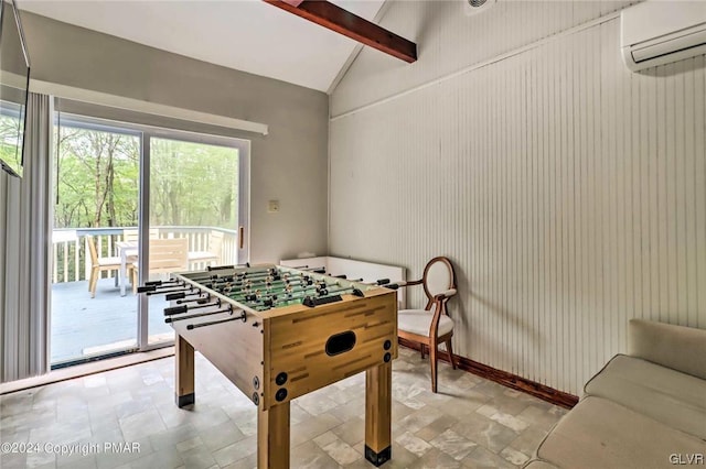 game room with lofted ceiling with beams, wooden walls, and a wall unit AC