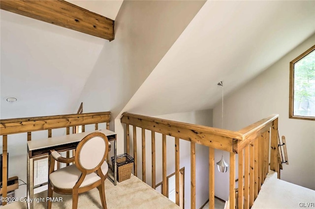 stairs featuring vaulted ceiling with beams