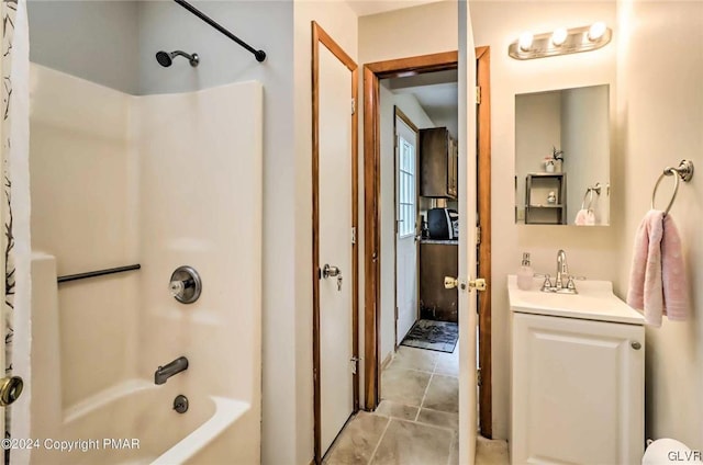 bathroom featuring shower / tub combo with curtain, tile patterned flooring, and vanity